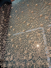 Floral abstract design sequins embroidered on mesh fabric sold by the yard