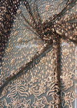Floral abstract design sequins embroidered on mesh fabric sold by the yard