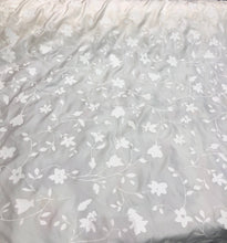 100% silk  58&quot; wide  Ivory silk with embosed ivory flowers on the fabric    Beautiful ivory color floral silk fabric sold by the yard