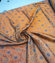 Burnt orange brocade 48&quot; wide   Beautiful burnt orange brocade fabric sold by the yard