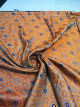 Burnt orange brocade 48&quot; wide   Beautiful burnt orange brocade fabric sold by the yard