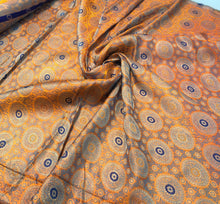 Burnt orange brocade 48&quot; wide   Beautiful burnt orange brocade fabric sold by the yard