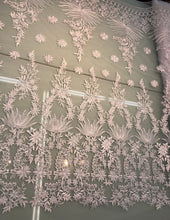 White bridal lace 52â wide.  Beautiful white bridal lace, border style white bridal lace fabric sold by the yard.