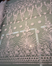 White bridal lace 52â wide.  Beautiful white bridal lace, border style white bridal lace fabric sold by the yard.