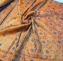 Burnt orange brocade 48&quot; wide   Beautiful burnt orange brocade fabric sold by the yard