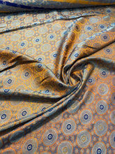 Burnt orange brocade 48&quot; wide   Beautiful burnt orange brocade fabric sold by the yard