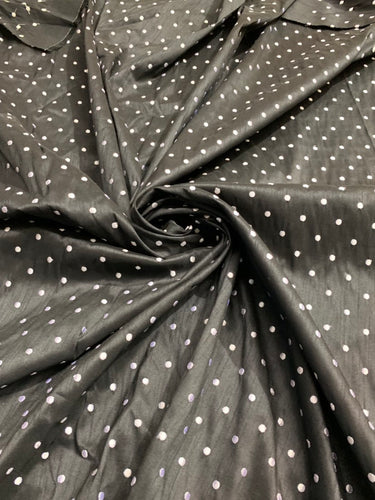 Shantung embaroidery 54" wide   Beautiful black shantung with white polka dots embroidered sokd by the yard