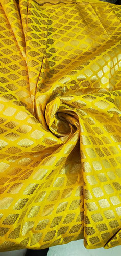 Yellow gold brocade 45" wide.  Beautiful yellow gold jacquard brocade sold by the yard. Best use for theatrical costumes