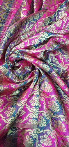 Fusia turquoise abstract design brocade 45" wide.  Beautiful fushia turquoise brocade sold by the yard. Best use for theatrical fabric