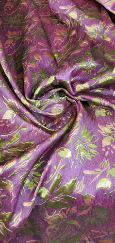 Purplish fusia gold doubke faced brocade 45" wide.  Beautiful gold purplish pink brocade sold by the yard.  Best use for theatrical costumes