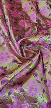 Purplish fusia gold doubke faced brocade 45&quot; wide.  Beautiful gold purplish pink brocade sold by the yard.  Best use for theatrical costumes
