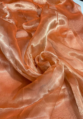 Matalic tissue organza 45" wide   Beautiful matalic orange color sold by the yard   Best use for appreal & home decor