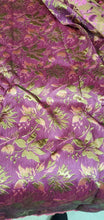 Purplish fusia gold doubke faced brocade 45&quot; wide.  Beautiful gold purplish pink brocade sold by the yard.  Best use for theatrical costumes