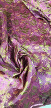 Purplish fusia gold doubke faced brocade 45&quot; wide.  Beautiful gold purplish pink brocade sold by the yard.  Best use for theatrical costumes