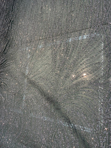 Glitter Metallic tule fabric useable for apparel, party decorations etc & much more..... 56â wide beautiful silver color