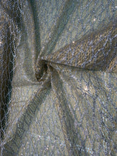 Glitter Metallic tule fabric useable for apparel, party decorations & much more..... 58â wide beautiful silver with gold on mesh