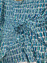 Designer digital print on Charmeuse fabric 54â wide.  Beautiful ivory base with blues combination sold by the yard.  Best use for Appearel