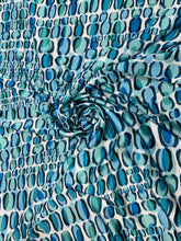 Designer digital print on Charmeuse fabric 54â wide.  Beautiful ivory base with blues combination sold by the yard.  Best use for Appearel