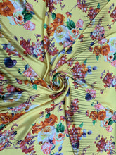 Designer digital printed Charmouse 54â wide.  Beautiful yellow base with colorful flowers print sold by the yard. Best use for apparel