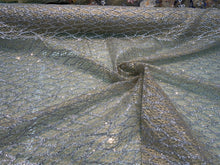 Glitter Metallic tule fabric useable for apparel, party decorations & much more..... 58â wide beautiful silver with gold on mesh