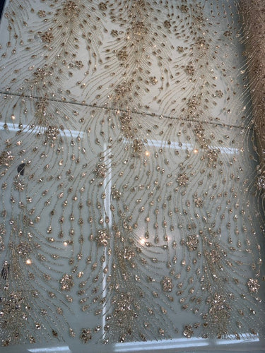 Glitter Metallic tule fabric useable for apparel, party decorations & much more.... 56â wide beautiful gold color