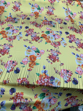 Designer digital printed Charmouse 54â wide.  Beautiful yellow base with colorful flowers print sold by the yard. Best use for apparel