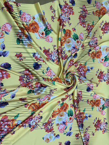 Designer digital printed Charmouse 54â wide.  Beautiful yellow base with colorful flowers print sold by the yard. Best use for apparel