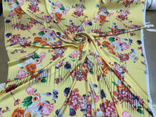 Designer digital printed Charmouse 54â wide.  Beautiful yellow base with colorful flowers print sold by the yard. Best use for apparel