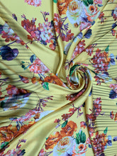 Designer digital printed Charmouse 54â wide.  Beautiful yellow base with colorful flowers print sold by the yard. Best use for apparel