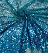 Sequin ombré design, 60” wide.  Beautiful turquoise blue border style sequin.