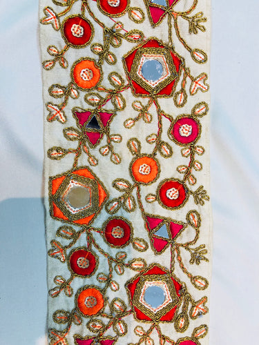Mirrored trim with multi color embroidery